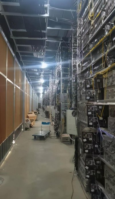 A well-maintained mining farm with rows of mining rigs